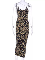 Leopard print spaghetti strap midi dress by Shopimist featuring a fitted silhouette and stylish animal print fabric.