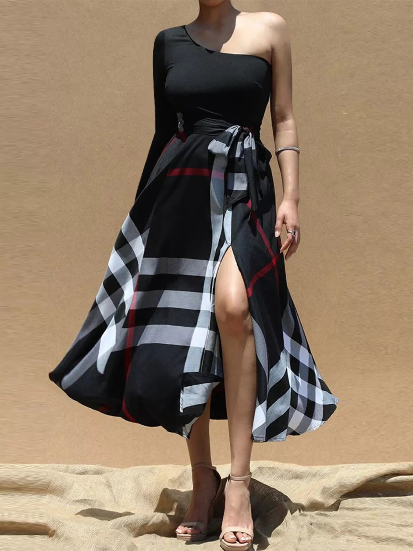 Asymmetrical one-sleeve plaid midi dress with waist tie by Plush Fashion Hub, showing stylish design and fitted silhouette.