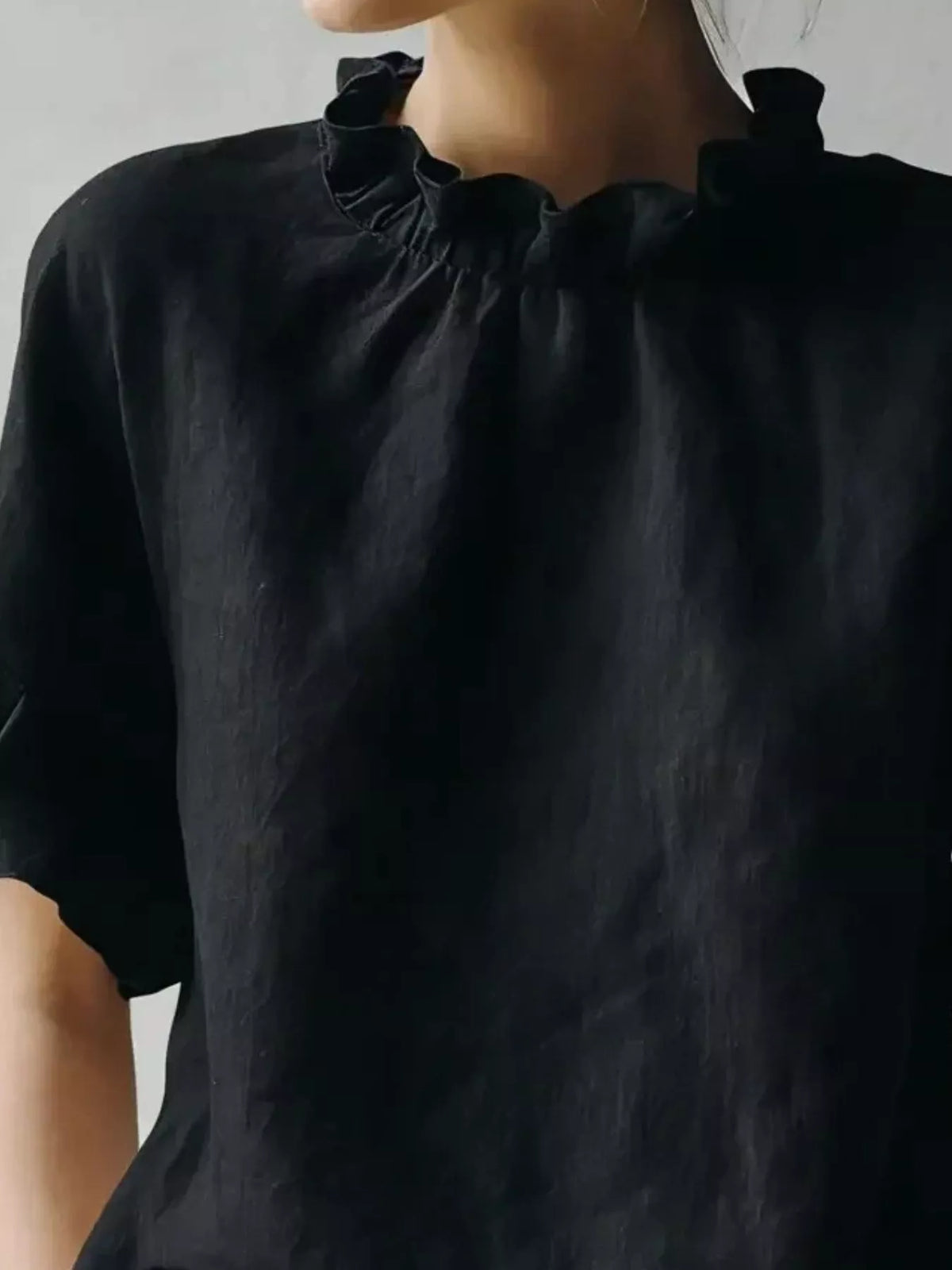 Plus size ruffled neck blouse from Plush Fashion Hub featuring half sleeves and a full-size fit, with a stylish ruffled neckline.