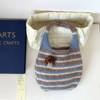 Striped knitted handbag by Shopimist, stylish and casual bag with colorful knit pattern and sturdy handles, perfect for everyday use.