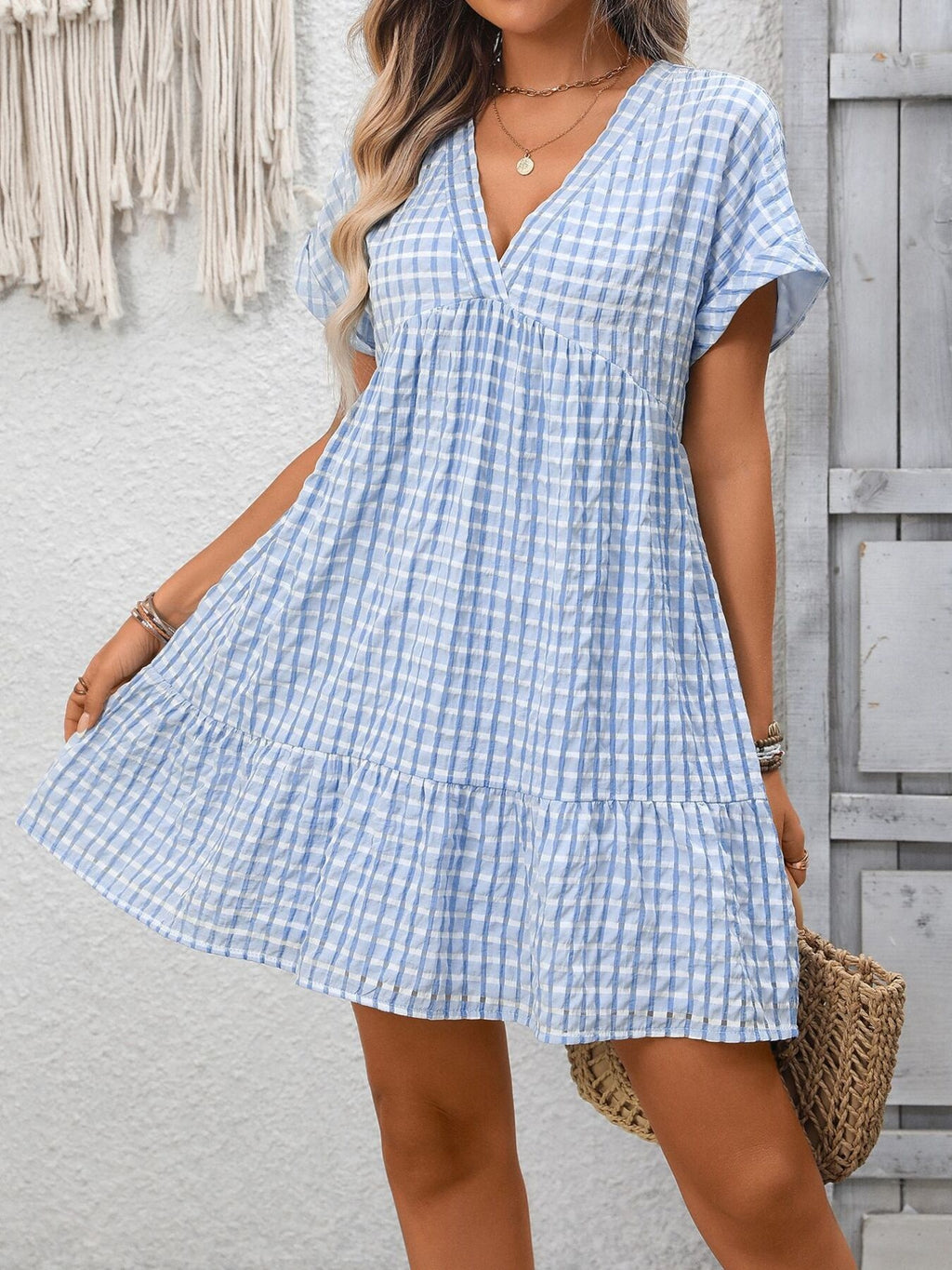 Plush Fashion Hub plaid V-neck mini dress with ruffle hem, lightweight fabric, perfect for seasonal fashion and casual outings.