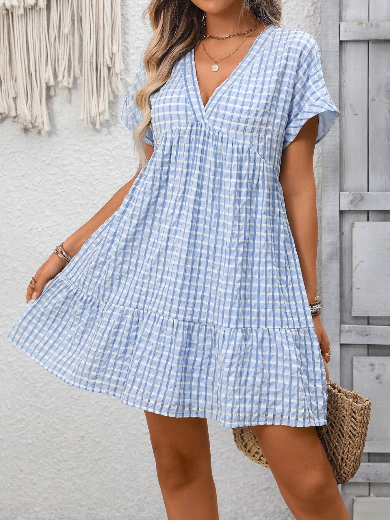 Plush Fashion Hub plaid V-neck mini dress with ruffle hem, lightweight fabric, perfect for seasonal fashion and casual outings.