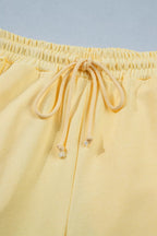 Plush Fashion Hub half sleeve top and drawstring pants set with rings design, casual loungewear for women.