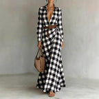 Women's belted irregular pleated dress by Plush Fashion Hub, showing a stylish dress with a waist belt and flowing pleats.
