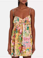 Floral print tie-shoulder mini dress featuring a fitted bodice and flared skirt, perfect for spring and summer occasions.
