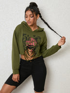 Long sleeve hoodie with cutout design from Trendsi, featuring a stylish and modern top in a casual, comfortable fit.