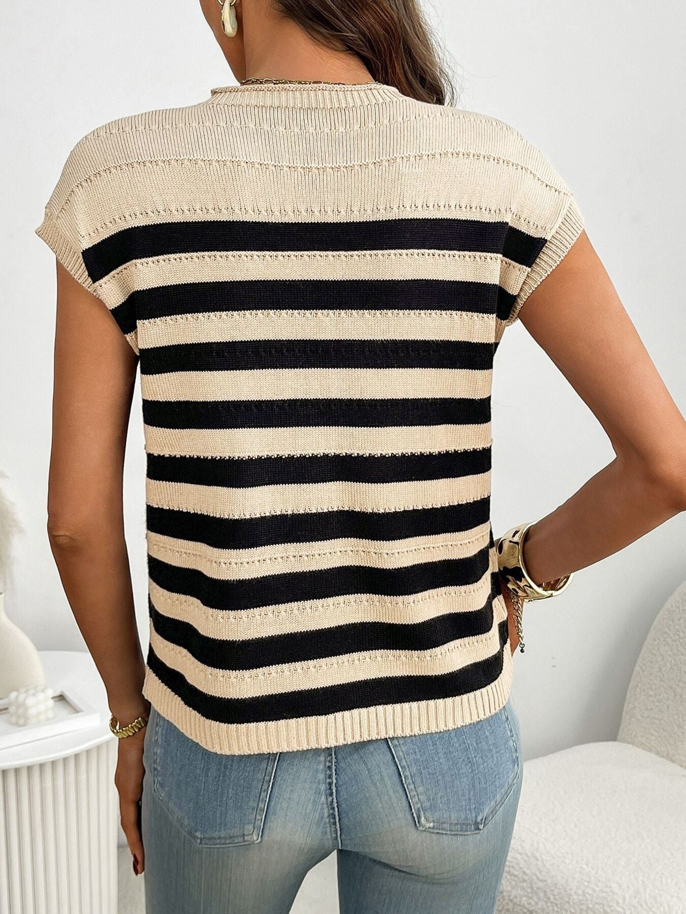 Women's striped knit cap sleeve sweater with pocket detail, stylish outerwear by Trendsi, featuring a cozy knit fabric and casual design.