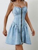 VYSN ruched zip-up denim dress with spaghetti straps, fitted bodice, and casual chic style, shown on a model.