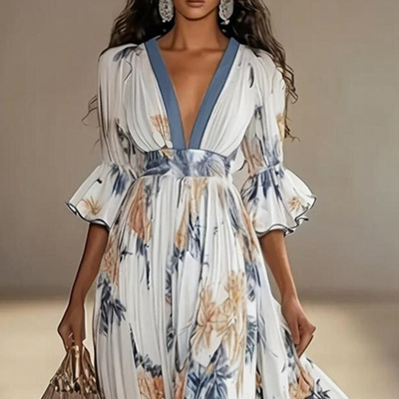 Women's floral print maxi dress with deep V-neck and flare sleeves, casualwear by Plush Fashion Hub.