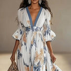 Women's floral print maxi dress with deep V-neck and flare sleeves, casualwear by Plush Fashion Hub.