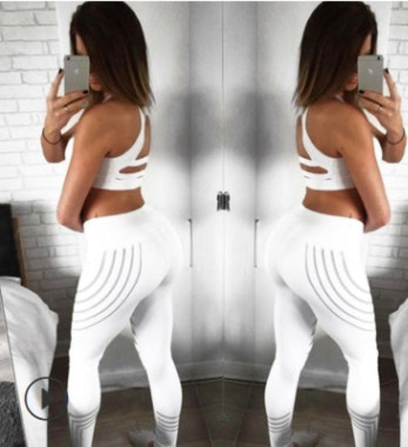 Women’s printed FitiqueFit activewear workout leggings, slim fit pencil pants with colorful geometric patterns, suitable for exercise.