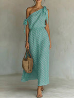 Full size polka dot one-shoulder maxi dress by Trendsi, featuring a flowing silhouette and stylish design in the image.