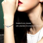Sterling silver heart zircon bracelet and necklace charm for mother, featuring a delicate design with sparkling stones.