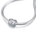 Sterling silver heart zircon charm bracelet and necklace for mother, featuring a delicate design and sparkling stones.