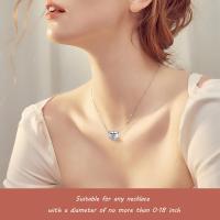 Sterling silver heart zircon bracelet and necklace charm for mother, featuring sparkling stones and intricate design.