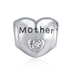 Sterling silver heart zircon bracelet and necklace charm for mother, featuring elegant design and shiny gemstone accents.