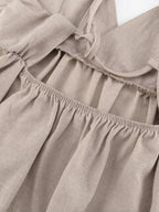 Backless spaghetti strap mini dress by Shopimist, featuring a stylish design with thin straps and a fitted silhouette.
