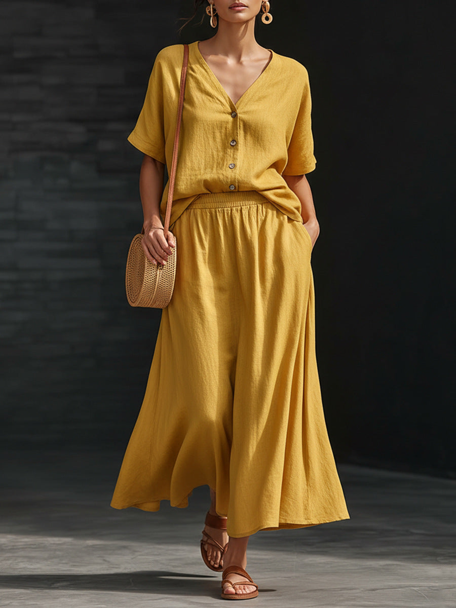 Women's casual V-neck button-up top and long skirt set by Plush Fashion Hub, featuring a stylish, coordinated outfit.