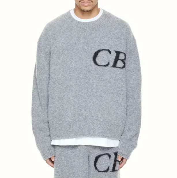 Unisex oversized knit crew neck sweater with CB letter design in beige and brown tones, from Plush Fashion Hub.