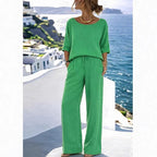 Women's resort set by FitiqueFit featuring a short sleeve top and wide-leg pants, perfect for warm weather and vacation wear.