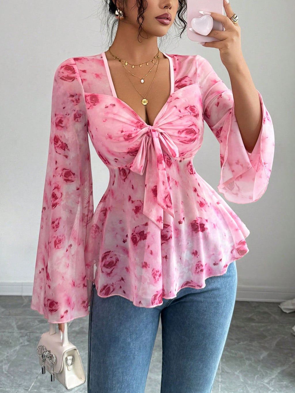 Floral print tie-front chiffon blouse with flare sleeves, stylish women's blouse from Trendsi, lightweight and flowy fabric.
