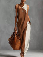 Plus size color block maxi dress with mock neck and sleeveless design by Trendsi, full-length dress in vibrant color blocks.
