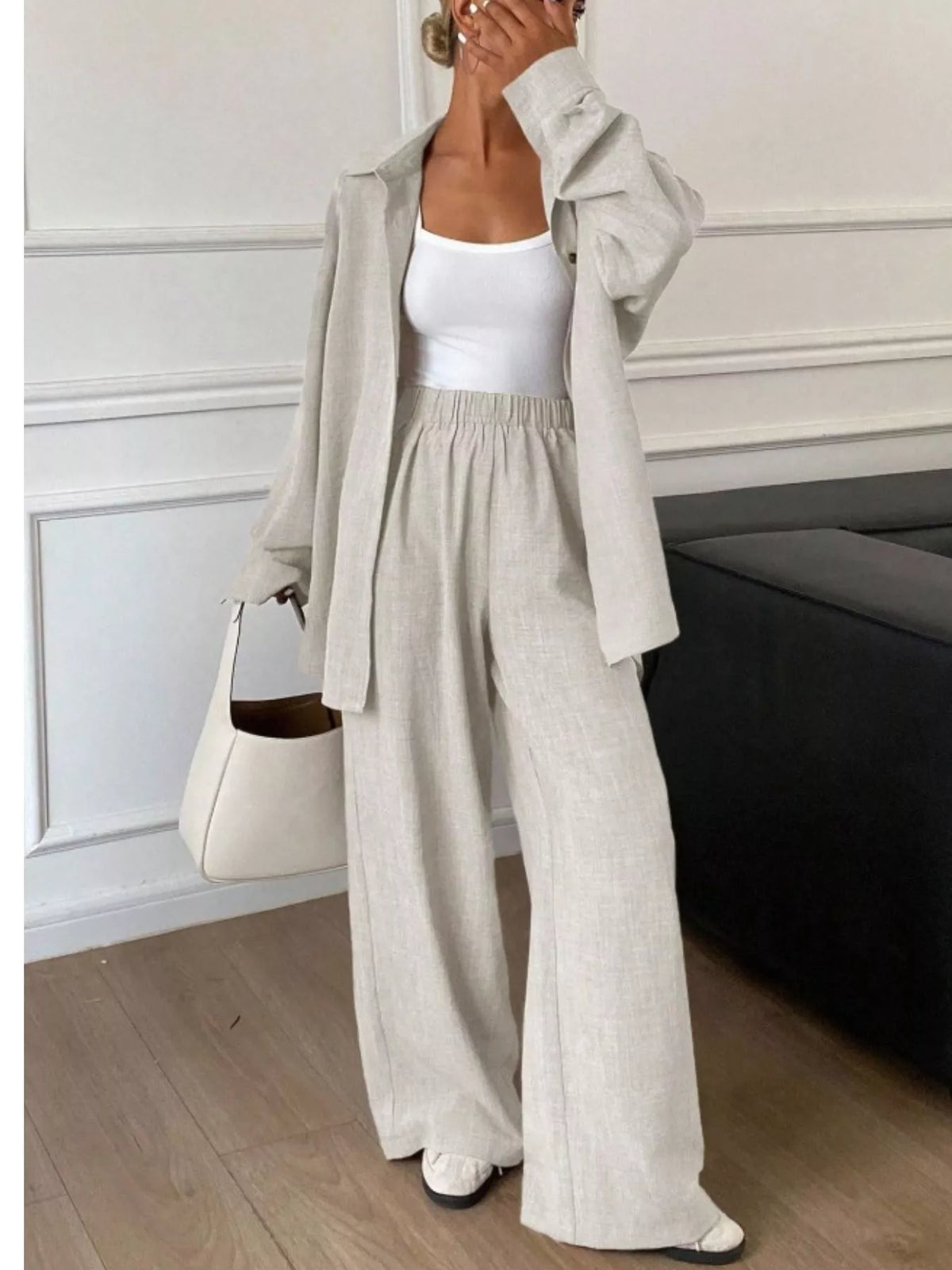 Trendsi long sleeve button-up shirt and wide-leg pants set, stylish casual outfit, light fabric, and modern fit.