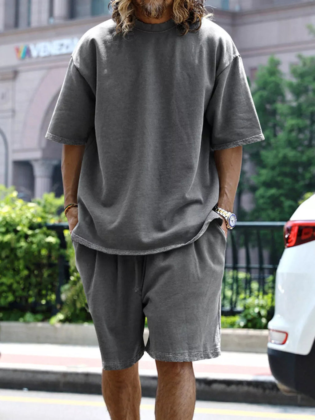 Plus size men's relaxed fit T-shirt and shorts set by Trendsi, featuring comfortable casual tops and shorts for everyday wear.