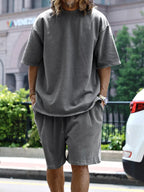 Plus size men's relaxed fit T-shirt and shorts set by Trendsi, featuring comfortable casual tops and shorts for everyday wear.