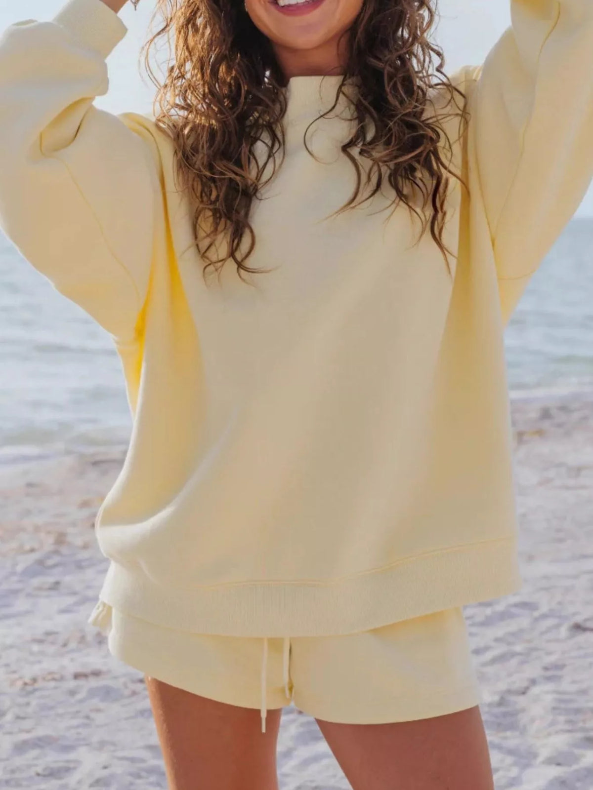 Plush Fashion Hub relaxed fit round neck sweatshirt and shorts set, featuring a comfortable casual 2-piece outfit in soft fabric.