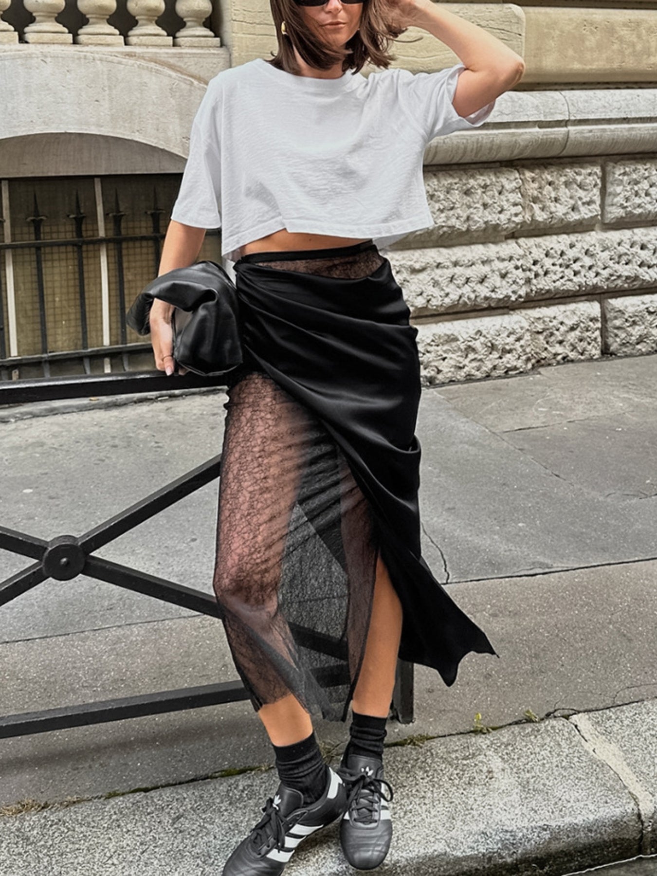 Women's elegant lace midi skirt with sheer split detail, flowing design, and trendy style from Trendsi.