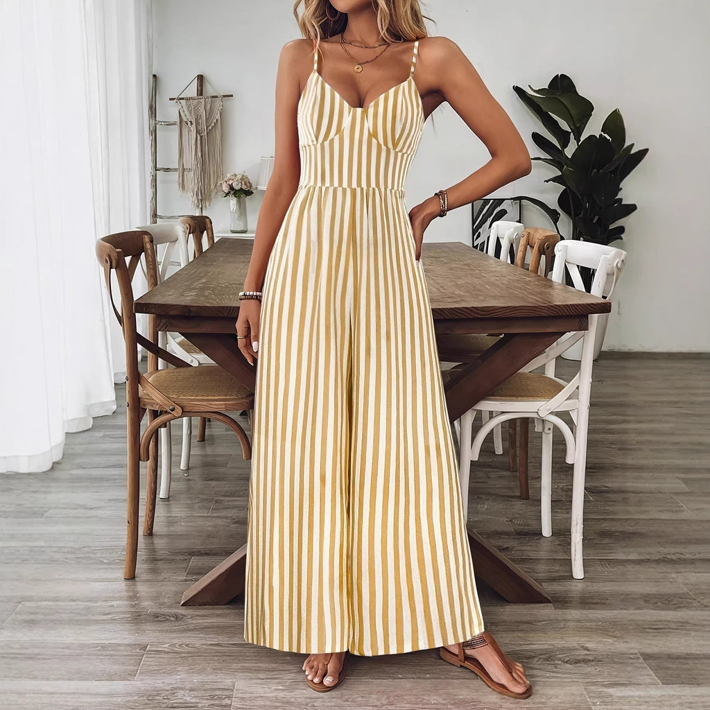Ginger yellow printed backless sleeveless strap jumpsuit by FitiqueFit, featuring a relaxed fit and stylish design.