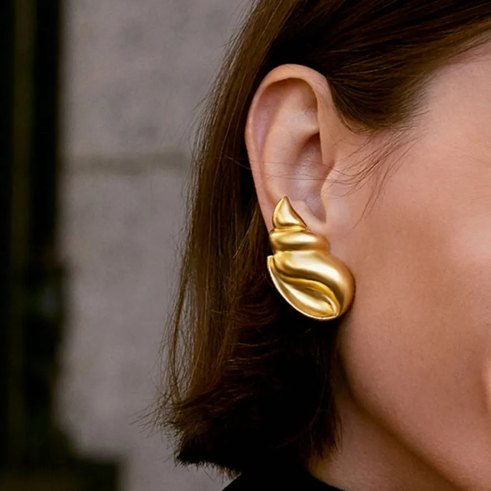 Gold-plated conch earrings with intricate design, crafted by Plush Fashion Hub, showcasing elegant jewelry for pierced ears.