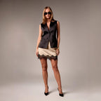 Solid color fitted mini skirt from FitiqueFit, casual street style bodycon skirt shown on a model in a stylish urban setting.