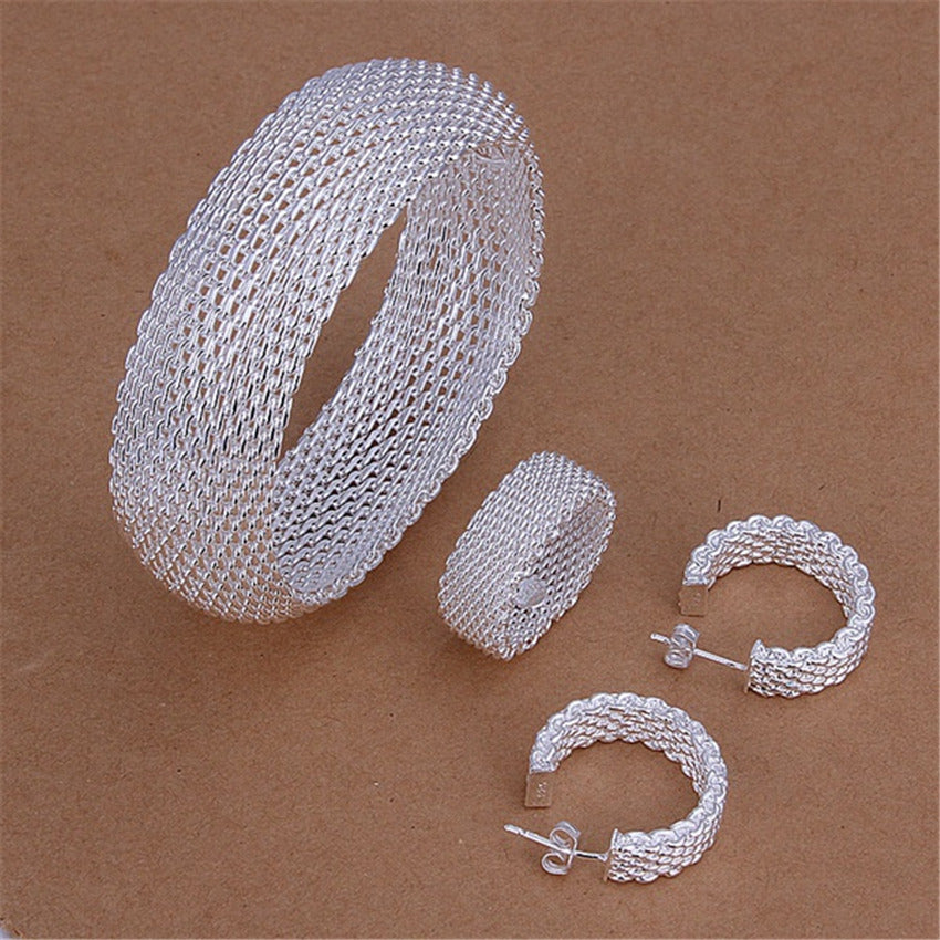 Set of retro net bracelet, earrings, and ring featuring intricate designs, perfect for vintage-inspired jewelry styles.