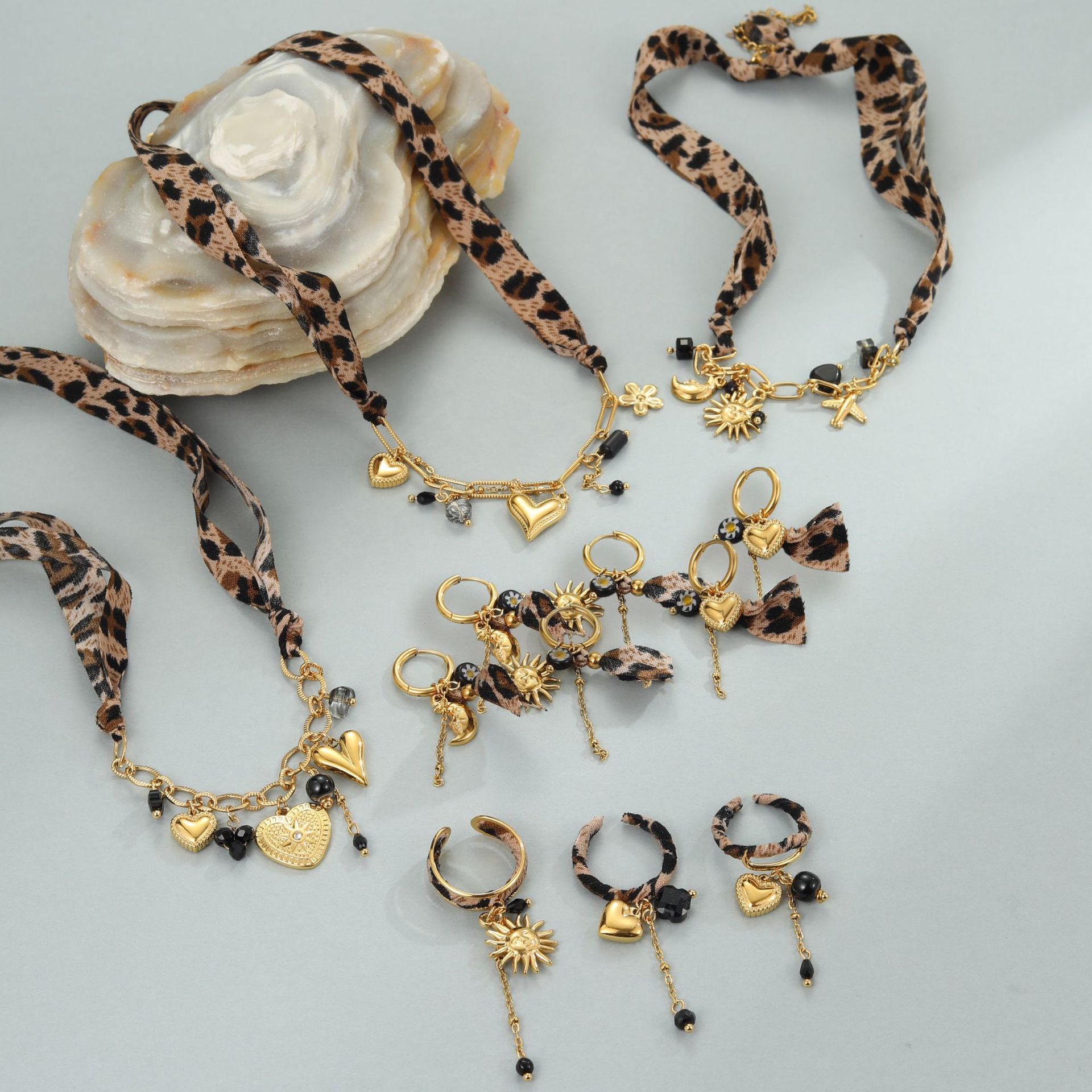 Leopard Series Love Sun Pendant made of stainless steel, featuring a sun and leopard design, jewelry ornament by Plush Fashion Hub.