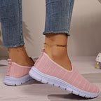 Women's breathable mesh slip-on casual flats from Trendsi, lightweight comfortable walking shoes with a sleek design.