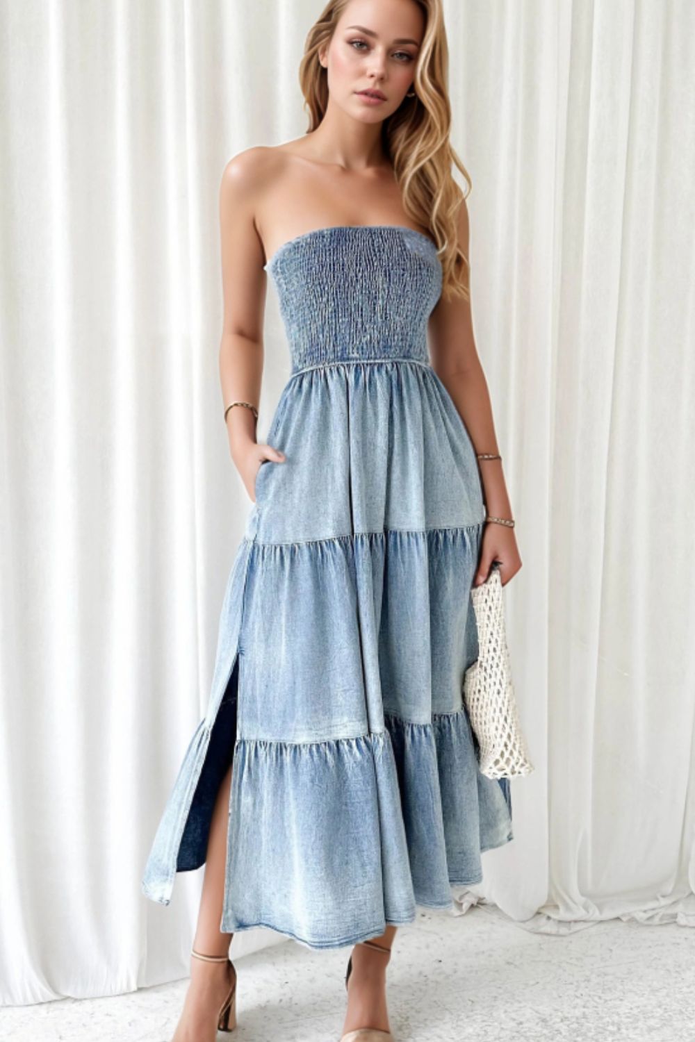 Smocked tube slit tiered denim dress by Plush Fashion Hub, featuring a fitted bodice, sleeveless design, and layered skirt for a chic look.