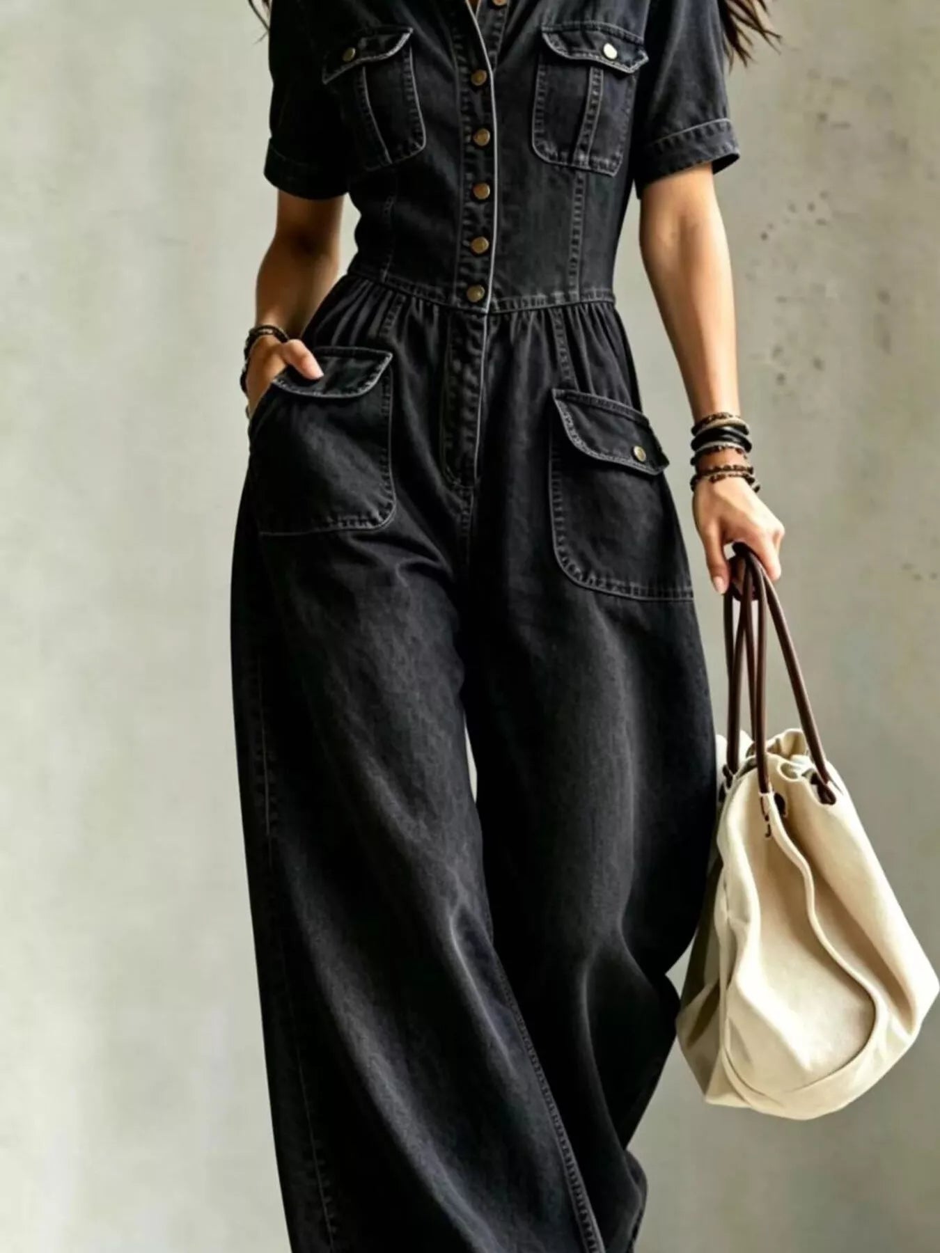 Plus size denim wide-leg jumpsuit with chest pockets, trendy casual jumpsuit from Trendsi, full-length front view.