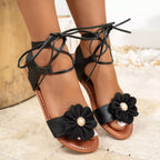 Open toe flower sandals by Shopimist featuring floral embellishments and stylish straps for a comfortable summer look.