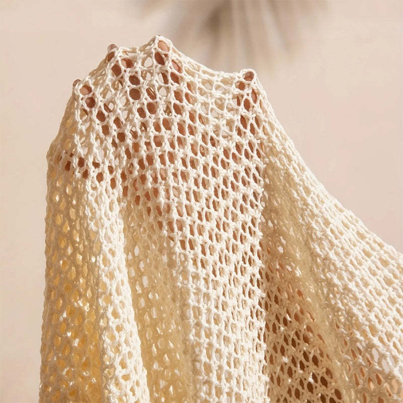 Women's elegant crochet cardigan by FitiqueFit, showcasing intricate knit pattern and lightweight, stylish design.