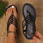 Shopimist toe post flats sandals featuring a minimalist design with comfortable straps and a flat sole.