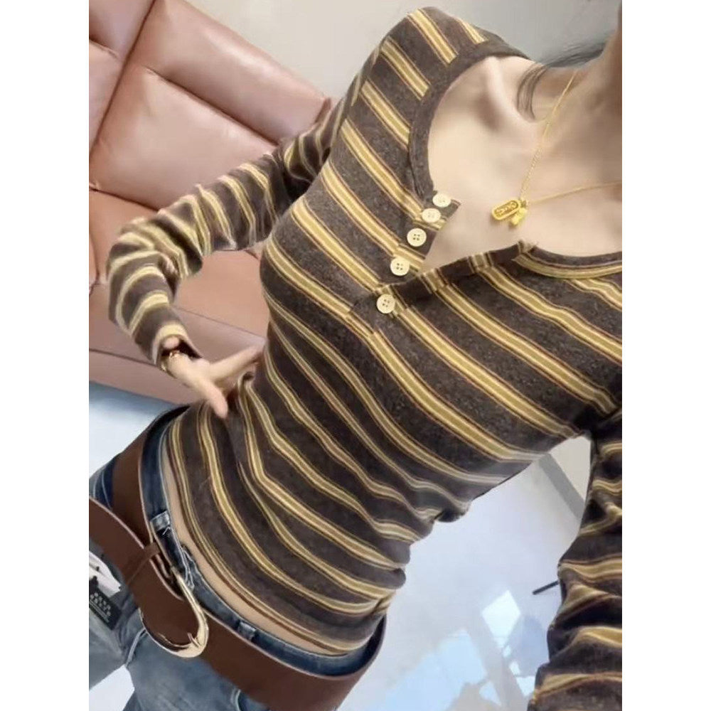 Soft beige cashmere ribbed Henley long sleeve shirt with buttoned placket by eprolo, showcasing its textured fabric and classic style.
