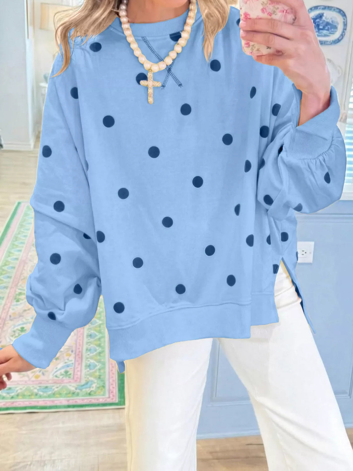 Polka dot oversized sweatshirt with side slit from Trendsi, featuring a relaxed fit and casual style in soft fabric.