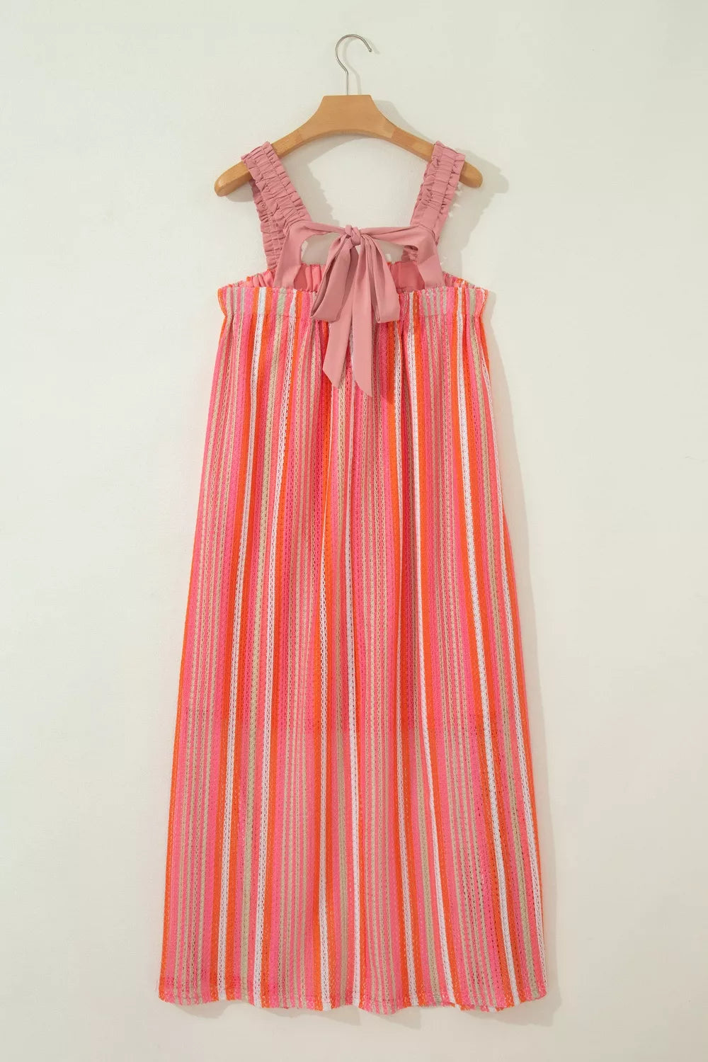 Flowy striped maxi dress with ruffled straps and ribbon knot detail from Plush Fashion Hub, perfect for vacation wear.