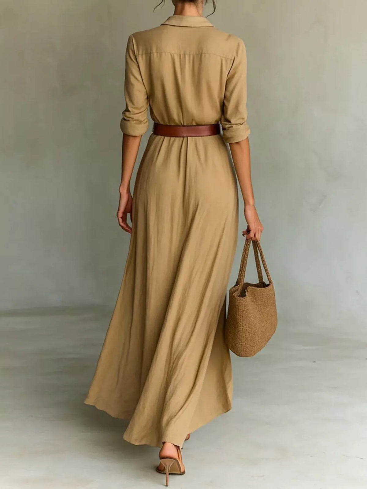 Plus size elegant V-neck ruched maxi dress with belt by Trendsi, featuring a flowing silhouette and full-length design.