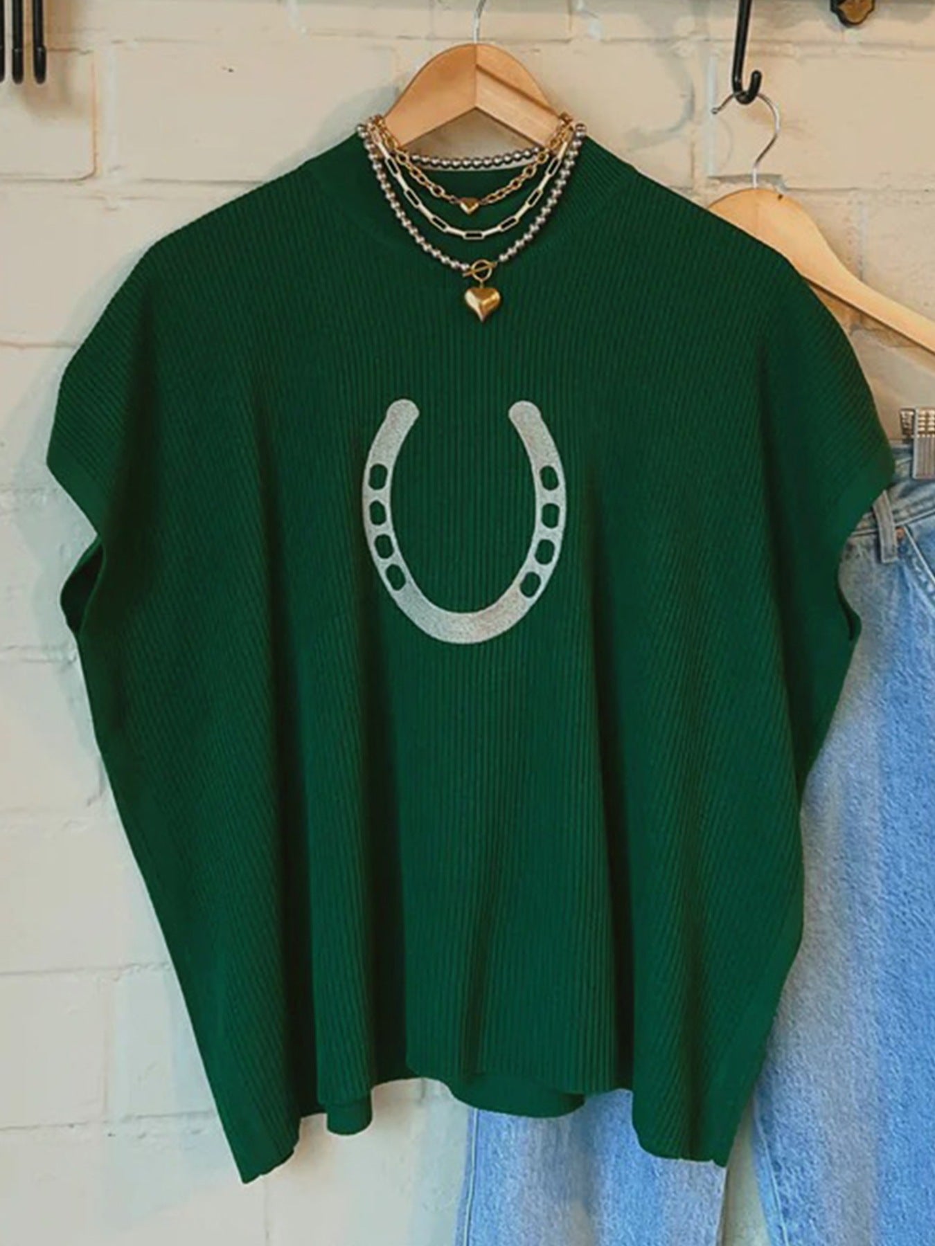 Women's ribbed knit short sleeve sweater with horseshoe graphic by Plush Fashion Hub, featuring a cozy ribbed texture.