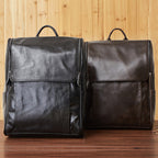 Black leather computer backpack by Plush Fashion Hub, featuring a sleek first layer leather design with multiple compartments.