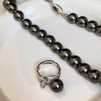 925 sterling silver ring with zircon stones and a pearl accent, elegant jewelry piece from Shopimist