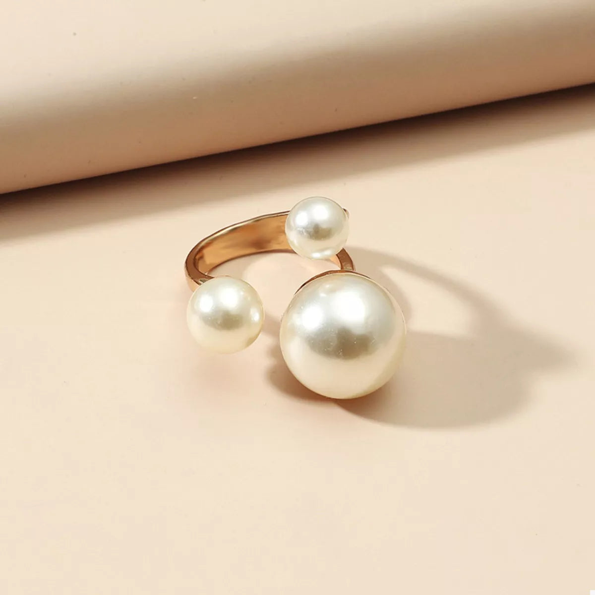 18K gold-plated pearl open ring with a sleek design, featuring a lustrous pearl centerpiece and elegant gold band.